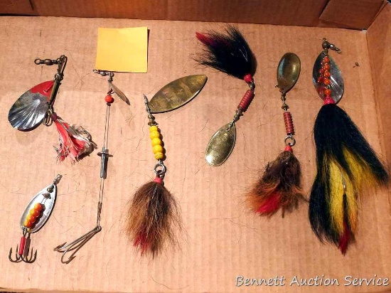 Five bucktails, plus a couple other fishing lures up to 9" overall.