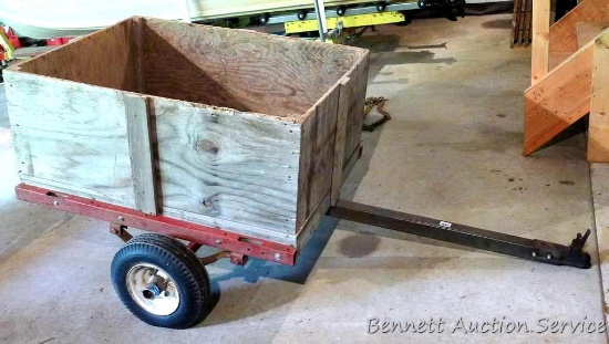 Two wheel metal frame trailer with 38" x 48" x 17" tall wood sides. Tires look in good shape, has