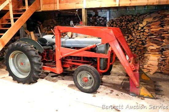 Ford tractor with 3 point hitch, rear tires are near new, front loader with manual bucket trip, 40"