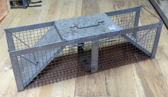Large live trap is 42" x 11" x 12" and appears in good shape.