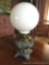 Kerosene Hurricane Lamp: Classy-looking kerosene lamp of heavy brass and pewter with hurricane