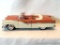 Model Car: 1956 Apricot and White Ford Sunliner Convertible, cast metal with plastic. Windshield