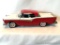 Model Car: 1957 Red and White Ford Fairlane Skyliner Hard Top Convertible, cast metal with plastic.