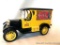 Model Car Bank: GM Panel Truck, Black and gold, cast metal coin bank. Red Coca-Cola advertising.
