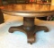 Round Oak Table: Antique Wormwood oak, Pineapple pedestal table; does have expansion rails. Some