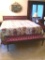 King-size Headboard & Footstool: Plum colored tufted upholstery. With metal frame. Mattress and box
