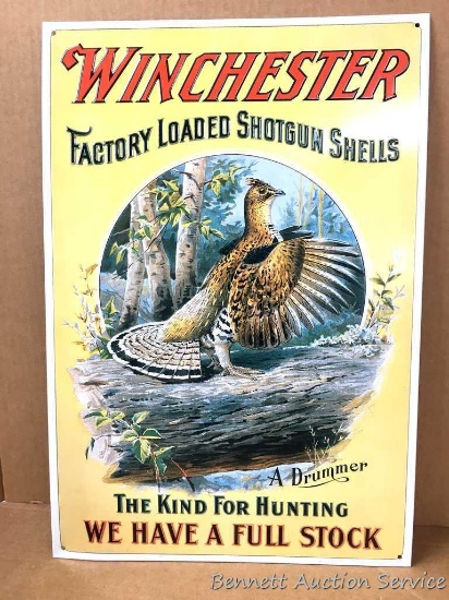 Metal sign: Winchester Factory Loaded Shotgun Shells advertising. "A Drummer" partridge on log with