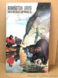Metal sign: Remington Advertising, Surprised bear with two in canoe. Metal with raised images of