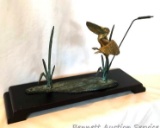 Brass Duck: Brass sculpture of landing duck in cattails. 18