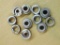 Assorted sizes and styles of shell holders for cartridge reloading, eleven pieces in all.