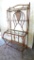 Metal framed wine rack with two glass shelves and a bottom wire shelf. Approx. 6' tall x 3' wide x