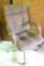 Brown padded swivel office chair. Rolls easily and is very comfortable.