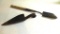 Two trapper's shovels. One is handmade out of iron and is 13