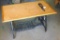 Ash coffee table with antique sewing cabinet legs and wheel. Approx. 20