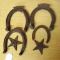 Vintage horseshoes and two star decorations.