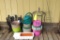 Large assortment of garden supplies incl. tomato cages, water can, planters and more.