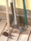 Spade shovel, rake, curved hoe and another hoe.
