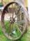 Antique steel tractor wheel, 4 ft. Nice yard decoration.