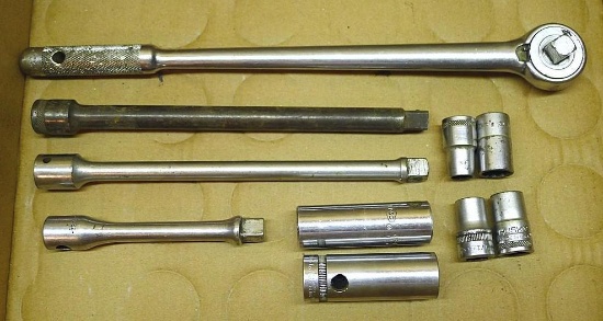 1/2" drive DuroChrome 15" ratchet; one 5-1/2" and two 10" extensions; assorted sockets. Ratchet