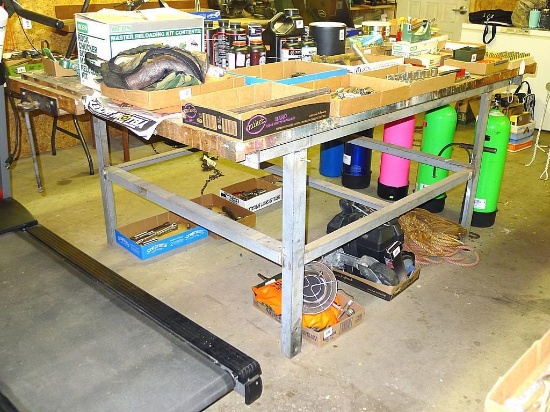 Great sturdy steel framed work bench measures 82" x 56" x 37" high. Each end has a vise mounted as