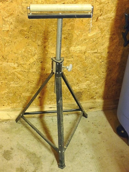 Adjustable height roller stand is in good shape. Currently 35" high.