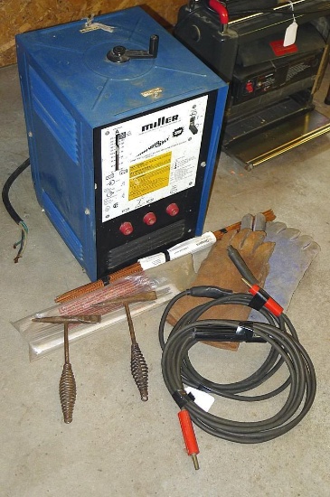 Miller Thunder Bolt AC welder with gloves, chipping hammers, assorted rod, more. Looks in good