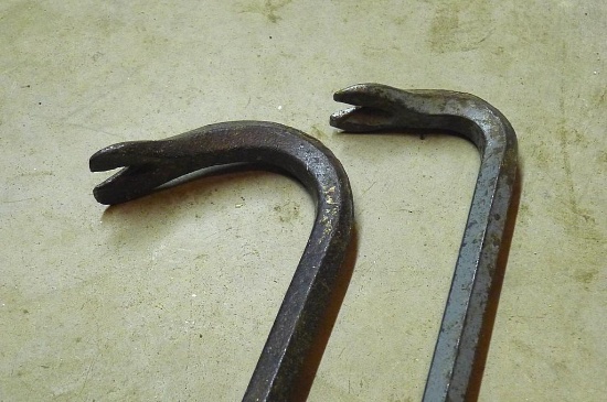 Two crowbars, 2 ft. long. Appear in good shape.