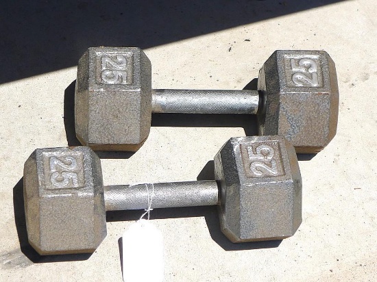 Two 25 lb. dumb bells.
