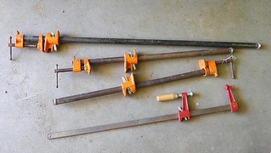 Three Pony pipe clamps, up to 3' and one other clamp.