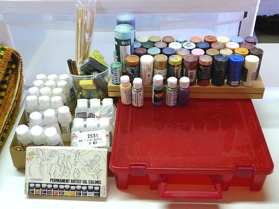 Nice assortment of craft paint, brushes, empty bottles, storage case and more. Paint includes Folk