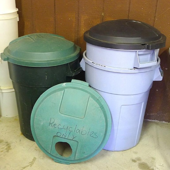 Three Rubbermaid garage cans with lids. Approx. 21-1/2" x 28" high. All show wear from use. One lid