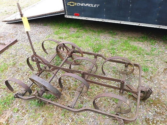 Spring tooth drag with metal wheels. Nice for pulling behind your ATV. Approx. 43" w x 64" l. Needs