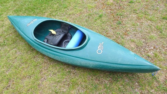 Old Town Guide Otter fiberglass kayak. Approx. 9' long x 30" w. Has seat with a backrest.