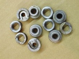 Assorted sizes and styles of shell holders for cartridge reloading, eleven pieces in all.