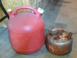 5 gallon Eagle gas tote is missing spout; 1 gallon steel gas can is in good condition.
