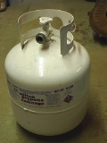 Propane cylinder with modern OPD valve and quite a bit of propane. Sloshes when you move it.