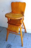 Antique high chair with adjustable foot rest. 17