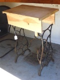 Handmade stand made using vintage sewing cabinet legs. Approx. 26