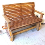 Wooden swing on a homemade stand. Swing is 51