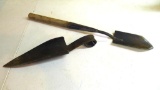 Two trapper's shovels. One is handmade out of iron and is 13