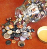 Quart jar of vintage buttons.