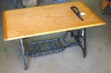 Ash coffee table with antique sewing cabinet legs and wheel. Approx. 20