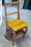 Unique wooden chair that folds into step ladder. Approx. 15