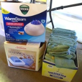 Bath towels, hand towels and wash clothes; Vicks warm stream vaporizer, model V150SGN; Sunbeam cool