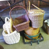 Nice assortment of woven baskets. Large white basket with handle is 11