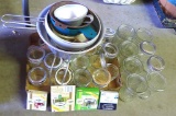 Canning supplies incl. eight pint jars, seventeen jelly jars, strainers, funnels and more.