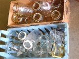 Canning jars including quart and 2 qt jars and more. Also included is a jar lifter. All in nice
