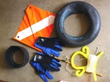 Scuba diving accessories including flag, tank holder and diving gloves.