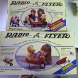 Radio Flyer Model 5 Wagon and Model 4 Little Red Wheelbarrow. Both are new in box.