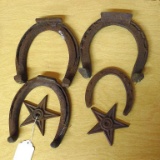 Vintage horseshoes and two star decorations.